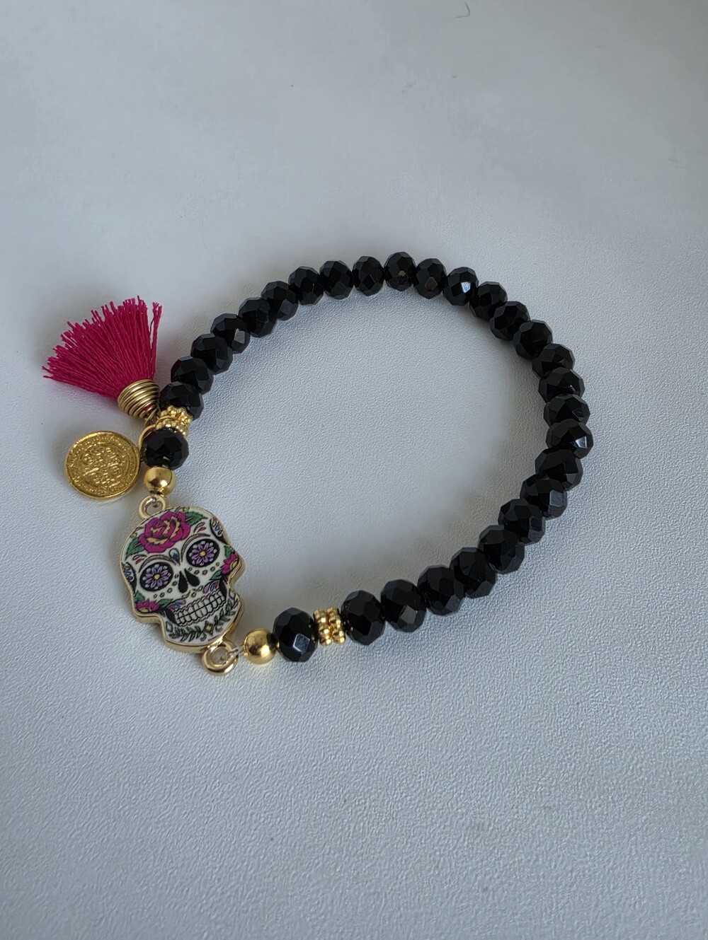 Handcrafted Black Bead Sugar Skull Stretch Bracelet with Pink Tassel